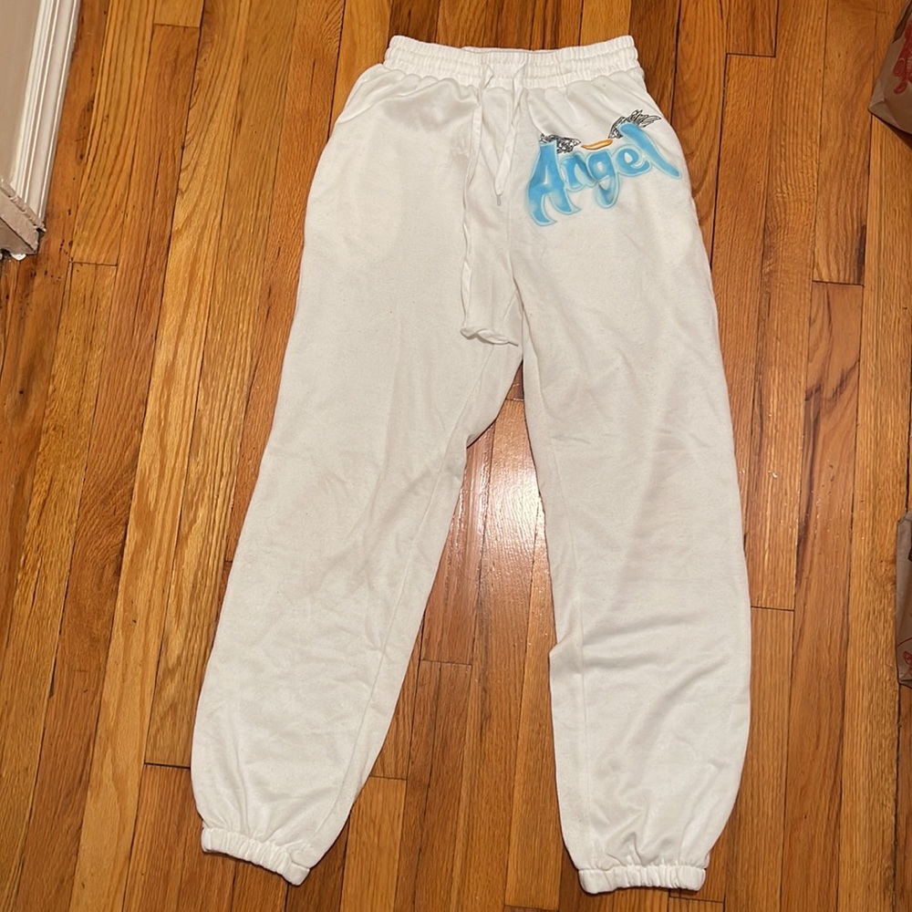 Woman’s white sweatpants